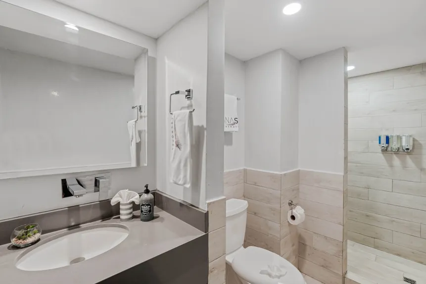Bunkhouse Suite full bathroom with vanity and walk-in shower