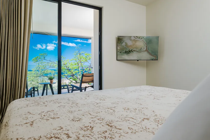 King bed facing the private oceanfront balcony