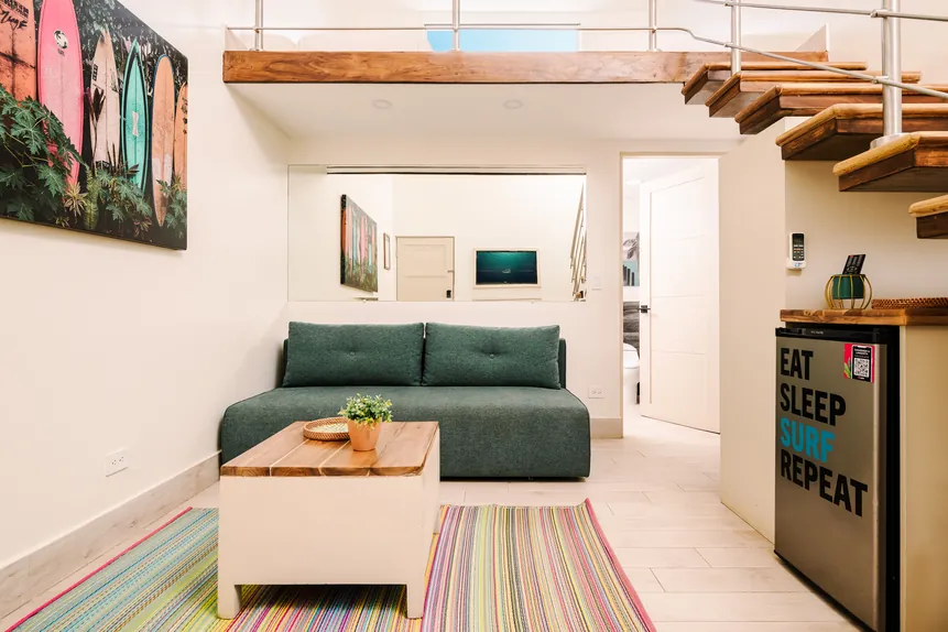 Surf Loft Suite living area with sofa and coffee table